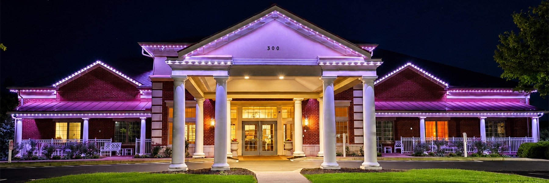 Valhalla Post Acute front of building lit up with LED lights